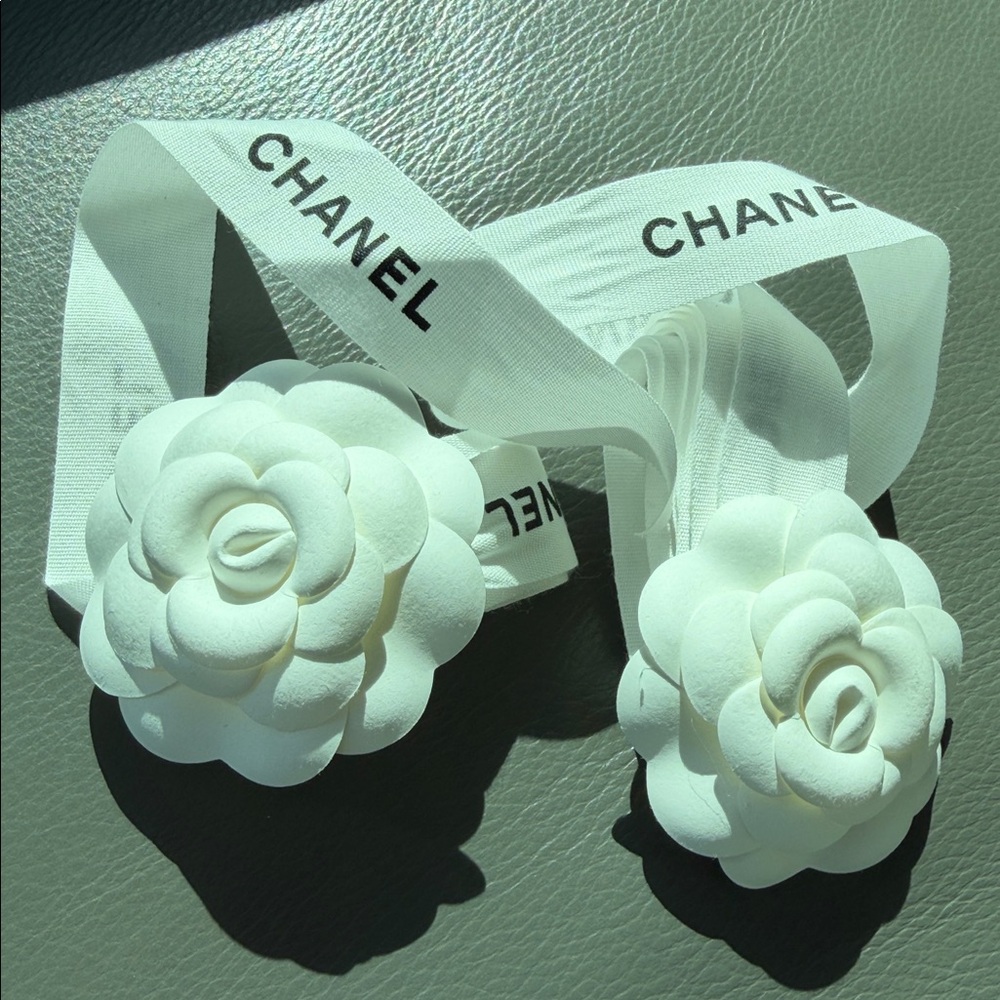 CHANEL 2 CAMELIA FLOWERS AND 2 CHANEL RIBBONs,  plus Chanel card